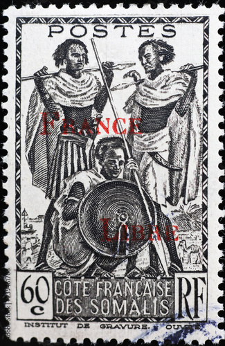 Three somali warriors on vintage postage stamp photo