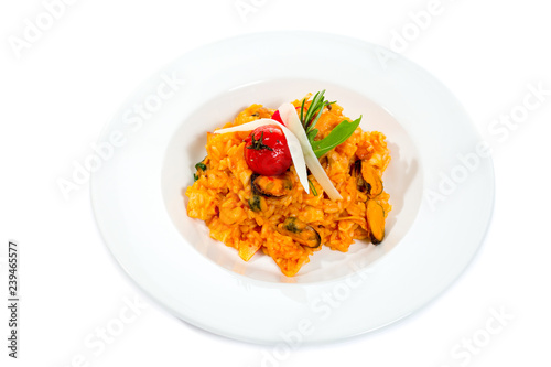 Seafood risotto with mussel shrimp and squid isolated on white