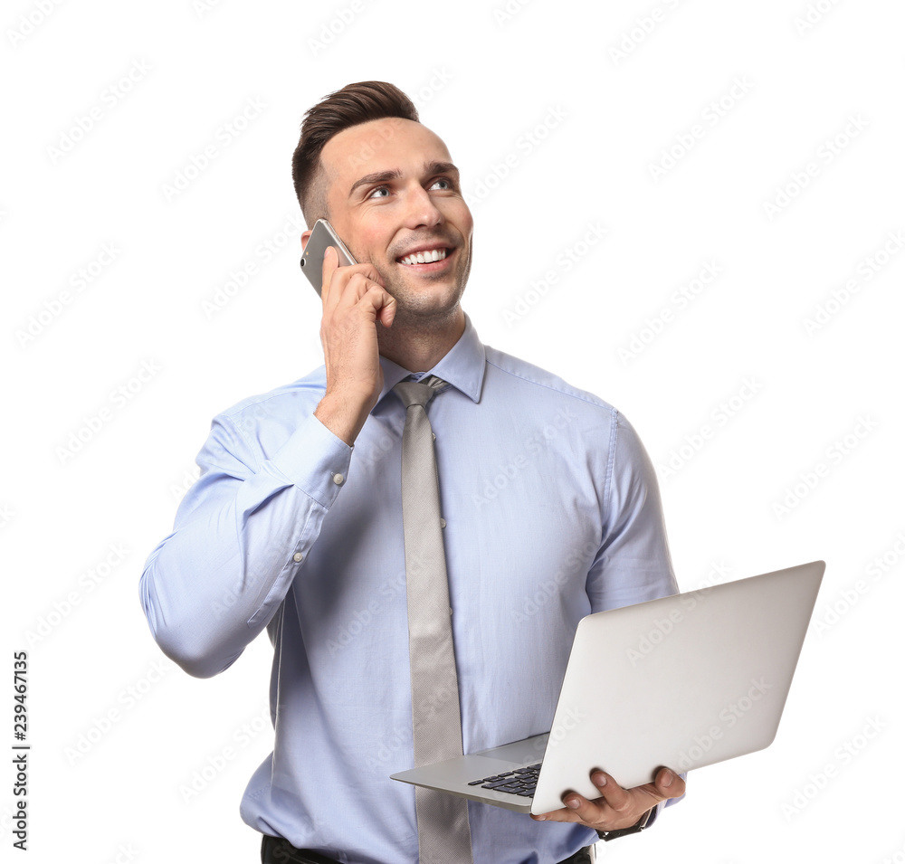 Young man with laptop talking by phone on white background Young man with laptop talking by phone on white background