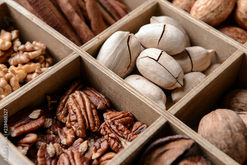 Assortment of nuts in divided box, closeup © Pixel-Shot