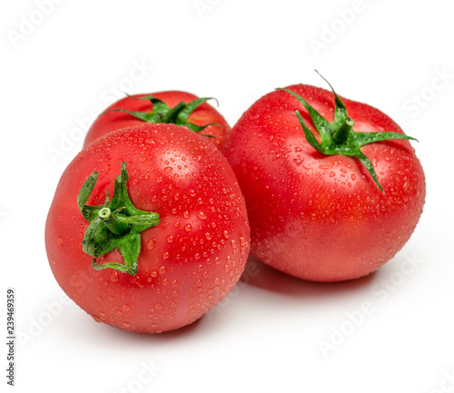 Three ripe  tomatoes isolated on white background