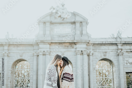 Couple women kissing on the street in Madrid city