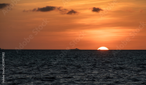 Orange sunset on the ocean at the Galapagos Islands © Stefano 