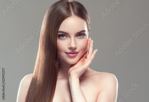 Beautiful hair smooth brunette woman beauty portrait healthy skin and haistyle 