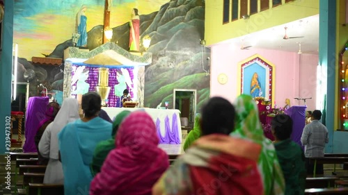 people praying portrait in church closeup  priest  blessing people photo