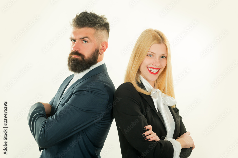 Young man and woman standing back-to-back with crossed hands against white background. Business man concept. Young man and woman standing back-to-back with crossed hands against white background. Business man concept.