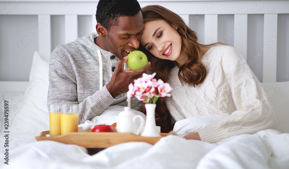happy couple with breakfast in bed on valentines day