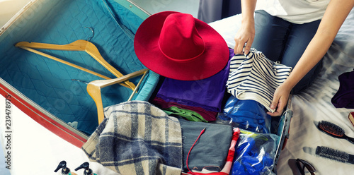 girl packing the luggage prepare for her trip