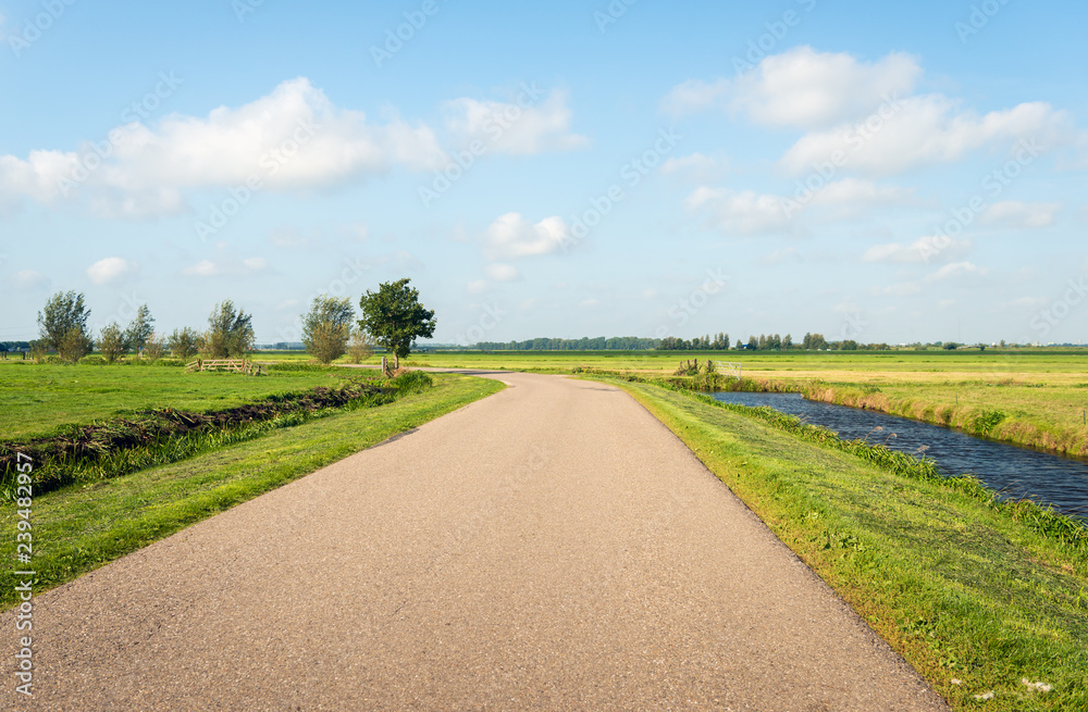 Curved road in a flat polder landscape