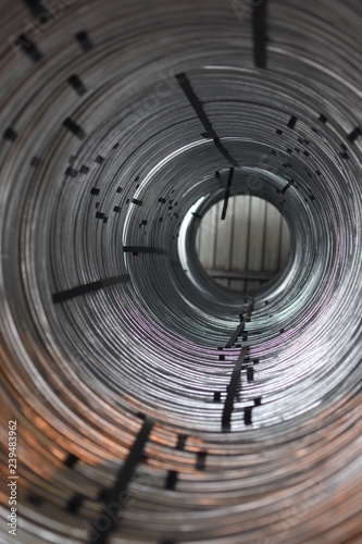 Tunnel of Coils of galvanized steel rod wire in a warehouse