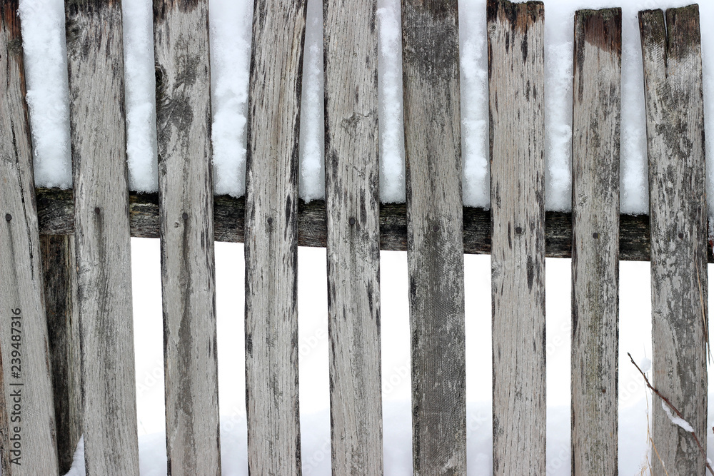 Picket fence snow covered old aged brown winter