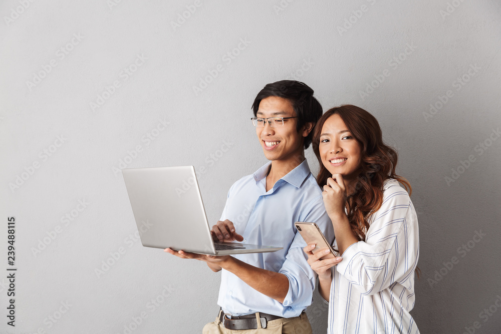 Happy asian couple standing isolated Happy asian couple standing isolated