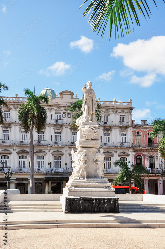 Monument and ancient buildings on the street of Havana. Old city street Havana. Cuba.
