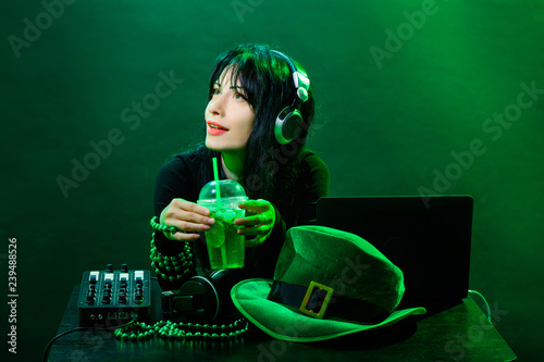 Portrait dj headphone st Patrick green hat cocktail drink equipment disco girl party desk mixer glamour disc young woman girl photo