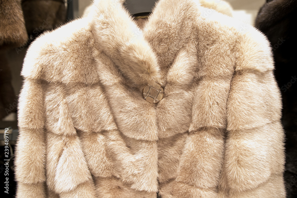 Luxury fur coats hanging on rack Luxury fur coats hanging on rack