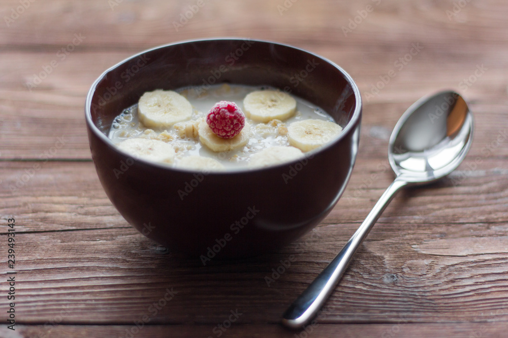 delicious hot oatmeal with fruit and berries on wooden background, healthy Breakfast delicious hot oatmeal with fruit and berries on wooden background, healthy Breakfast