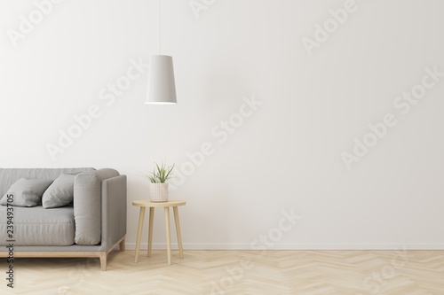 Interior of living room modern style with grey fabric sofa,wooden side table and white ceiling lamp on wooden floor.