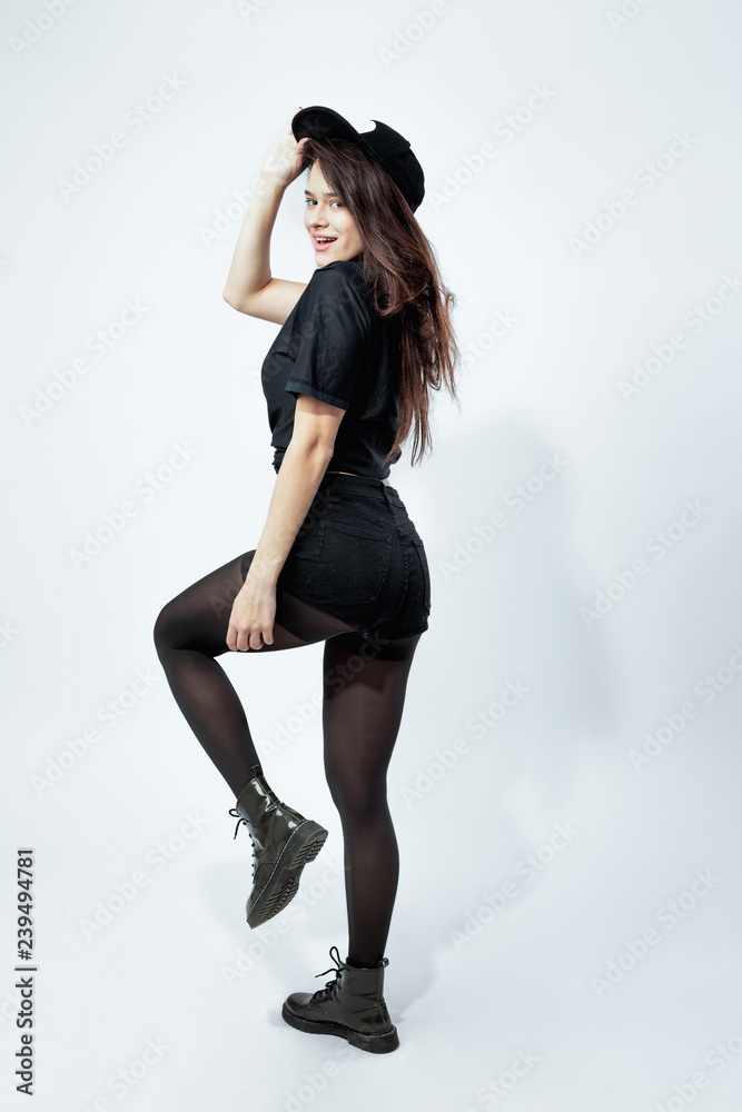 Beautiful girl in black leggings and a t-shirt, happy face, long hair, a  smile on his face, dancing Stock Photo by ©VladimirDrozdin 59724665