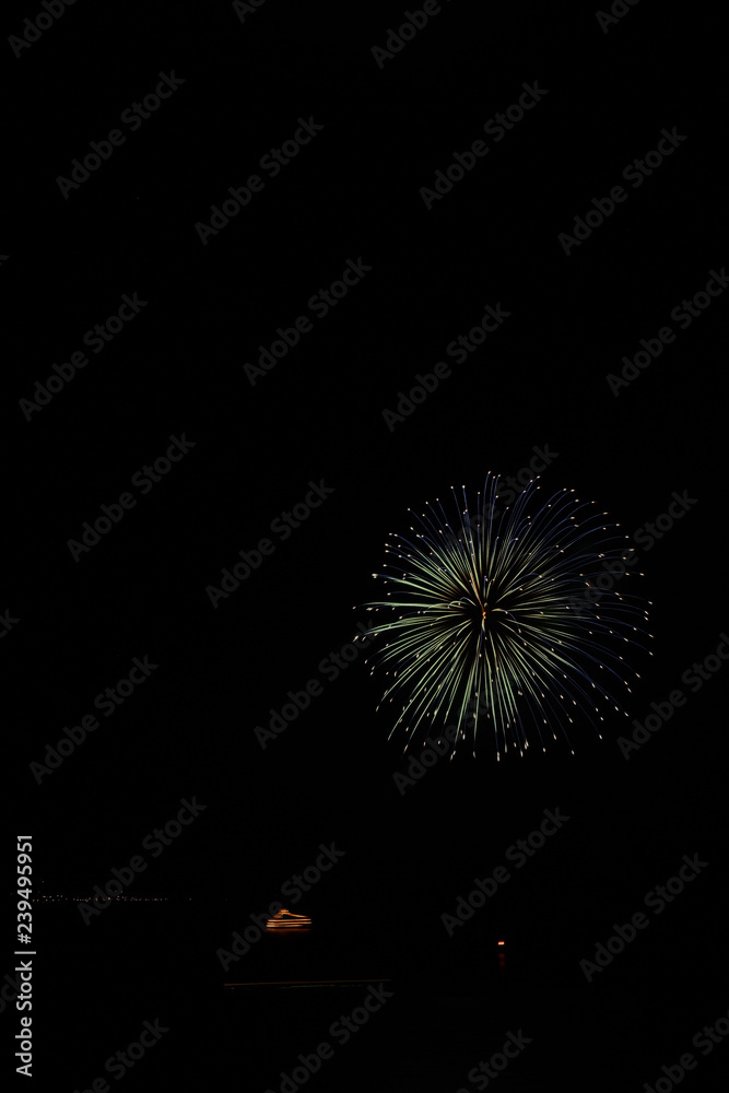minimal firework ball with movement boat and light in toya lake, japan minimal firework ball with movement boat and light in toya lake, japan