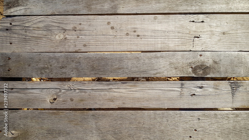Peeled and faded plank wooden texture wallpaper.