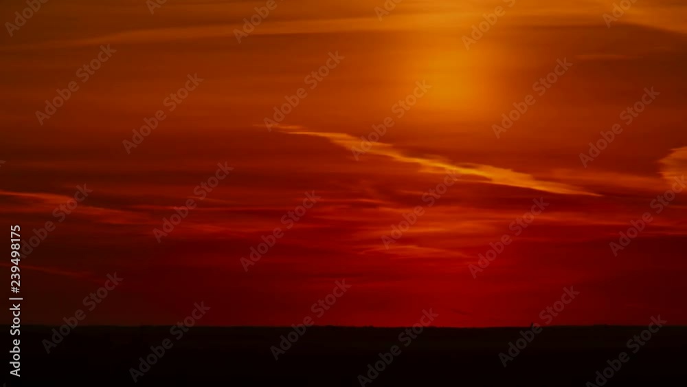 Long Shot of beautiful orange sunset sky with complete sun