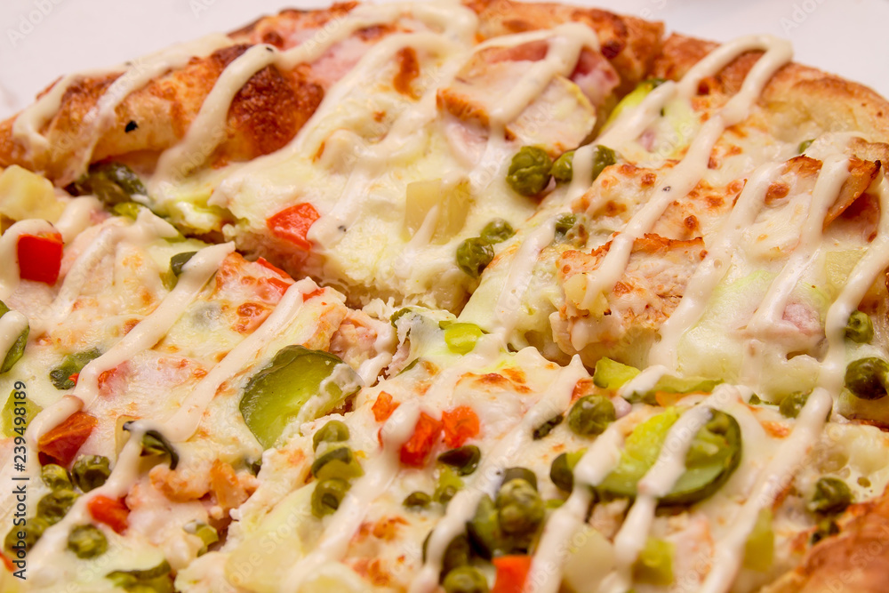 Close up: Delicious Pizza with Mozarella, Pickles, Cheese, Beef, Chilli Jalapeno Pepper, Olive, Green Pepper and Tomato Close up: Delicious Pizza with Mozarella, Pickles, Cheese, Beef, Chilli Jalapeno Pepper, Olive, Green Pepper and Tomato
