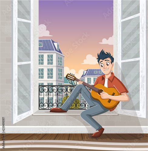 Young man playing guitar in the window. Music in the city.