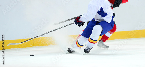 Photography close-up with the puck during the game. Hockey, winter sport