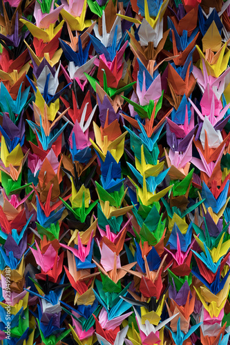 Bunches of colorful Origami paper crane birds full frame