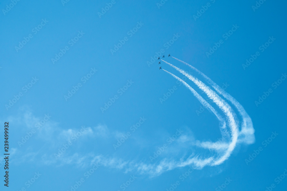 Planes perform aerobatics Planes perform aerobatics