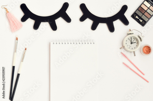 Time for beauty eyelashes and eyebrows: eyelash extension tools and decor on white background with copy space. top view. Flatley