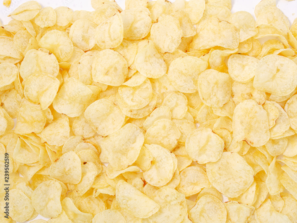 natural potato chips golden on a white background. natural potato chips golden on a white background.