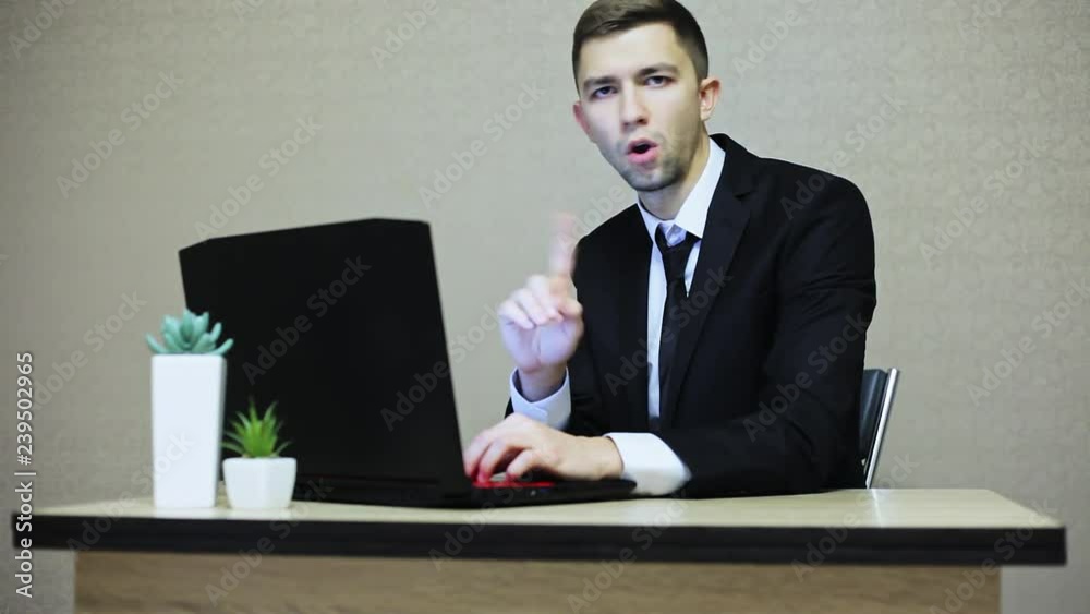 No, Businessman rejecting by shaking head, while working on laptop, man rejecting offer by waving finger No, Businessman rejecting by shaking head, while working on laptop, man rejecting offer by waving finger