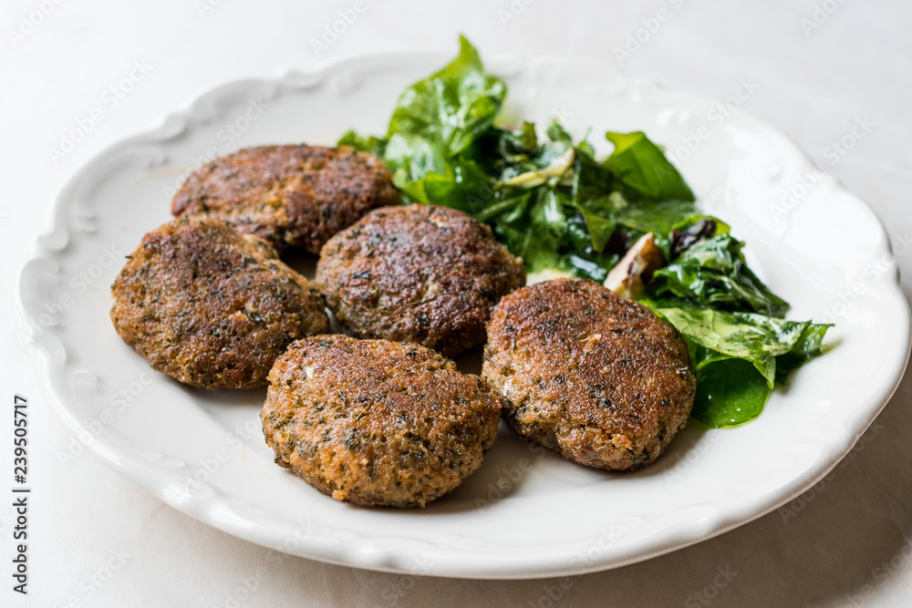 Homemade Salmon Meatballs Served with Orange Salad. Homemade Salmon Meatballs Served with Orange Salad.