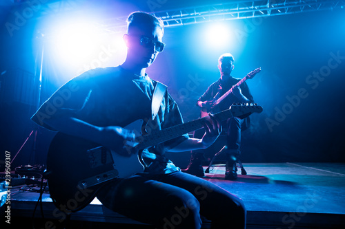 Musicians perform on stage in the club. © Voloshyn Roman