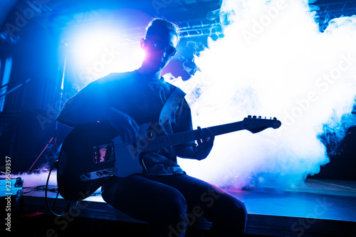 Musicians perform on stage in the club.