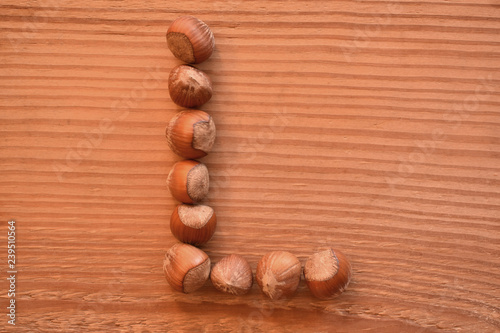 the letter L made with hazelnuts