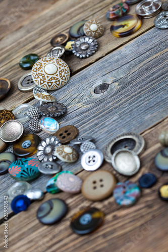 placer of vintage buttons on aged boards