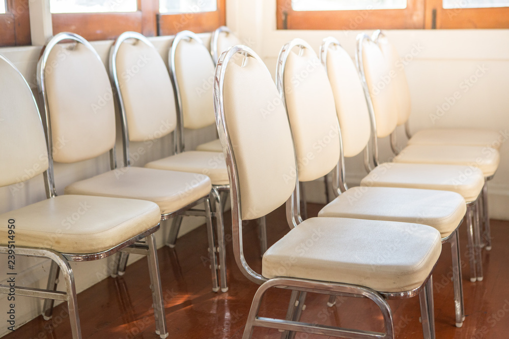 White chairs arranged in a seminar room