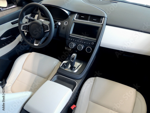 Top view of front seats with white leather trim in combined car interior 