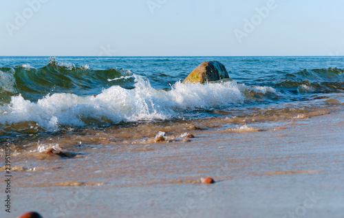 Foto Sea coast. Waves and storms at sea. Waves on the Baltic Sea.