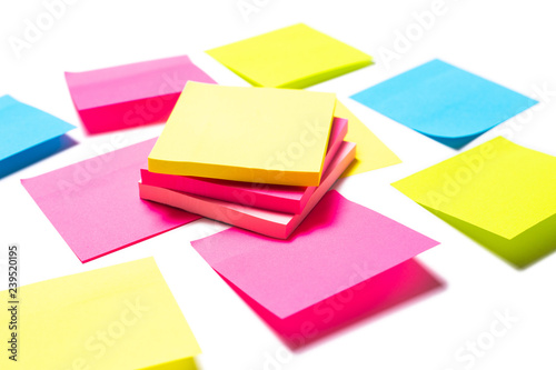 Many colorful sticky notes on white background
