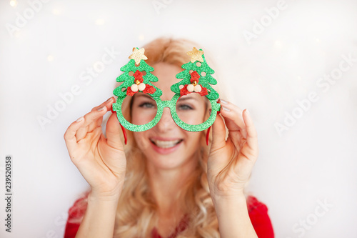 Portrait of beautiful female model wear santa glasses