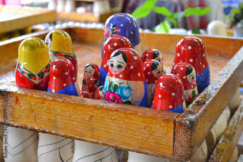 NIZHNY NOVGOROD, RUSSIA - JUNE 15, 2014: Production of nesting dolls in Semenov city known for its famous Khokhloma painting photo