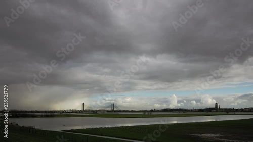 Dramatic Dutch Sky above river Waal timelapse recording  photo