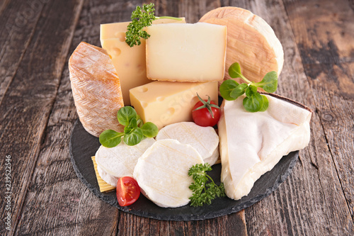 assorted cheese on wood background