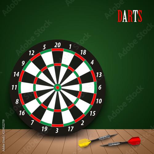 Dart boards with colored steel darts on green background