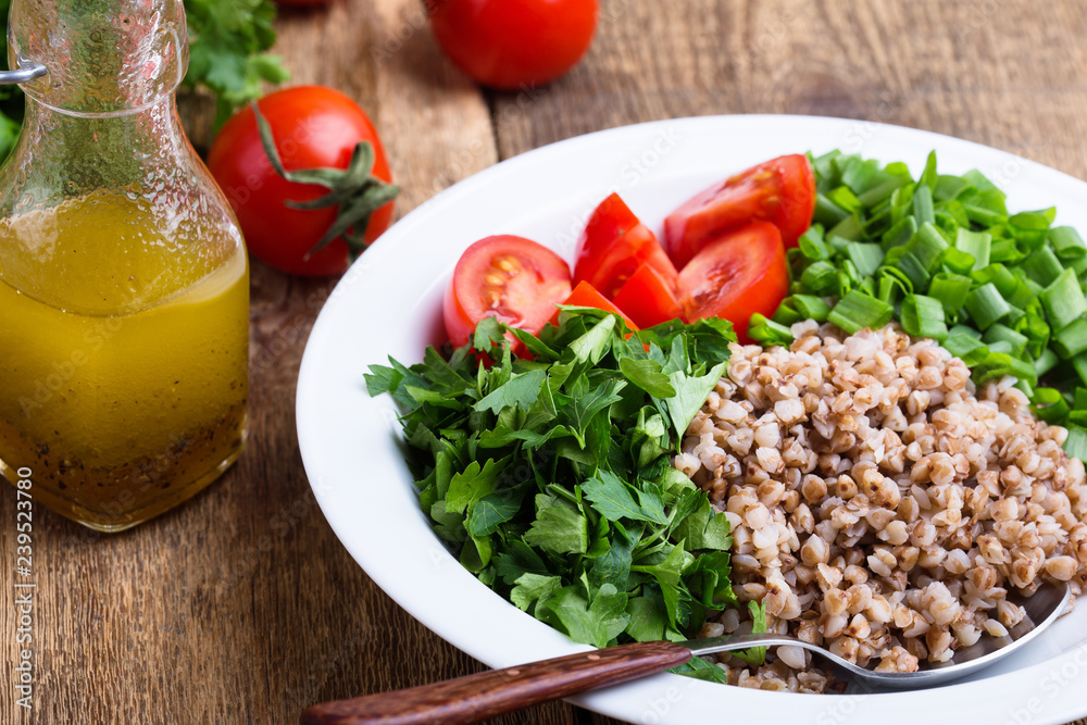 Healthy cooked buckwheat grain salad with fresh vegetables Healthy cooked buckwheat grain salad with fresh vegetables