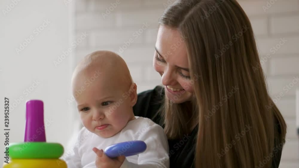 little child boy and his mommy play with toys at home little child boy and his mommy play with toys at home