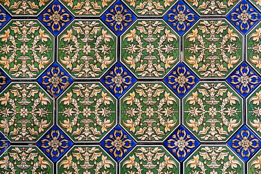 Pattenes on traditional tiles of historical house wall of Andalusia